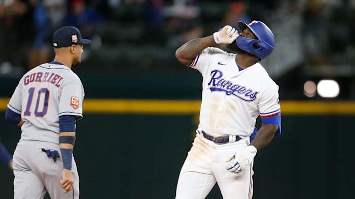 Apr 25, 2022; Arlington, Texas, USA; Texas Rangers right fielder Adolis Garcia (53) reacts after hitting a double that drove in three runs in the eighth inning against the Houston Astros at Globe Life Field. Mandatory Credit: Tim Heitman-USA TODAY Sports